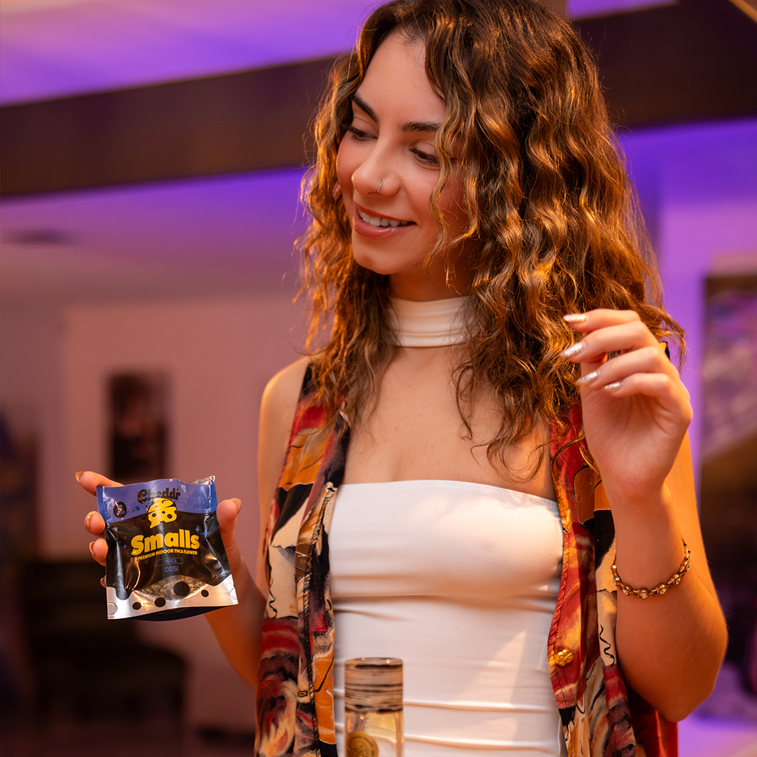 Cheddr founder holding Smalls product